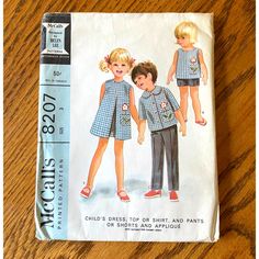 Uncut Vintage 1960s Mccalls 8207 Sewing Pattern Toddler Girls Size 3 Dress Top Pant Shorts Vintage Fashion Designer Pattern Size: 3, 3t B: 22" W: 20.5" Year: 1967 Fashion Designer Helen Lee - Child's Dress, Top Or Shirt, And Pants Or Shorts And Applique. Sleeveless Dress And Top, Front Buttoned Shirt With Elbow Length Set-In Sleeves, And Long Pants Or Shorts With Elastic In Casing At Back Waistline. Dress, Top And Shirt Have Faced Bias Pocket, Appliqued Flower And Embroidered Stem And Leaves On Helen Lee, Kids Fasion, Book Sewing, Toddler Sewing Patterns, Waistline Dress, Childrens Sewing Patterns, Toddler Girl Summer, Buttoned Shirt, Sewing Patterns Girls