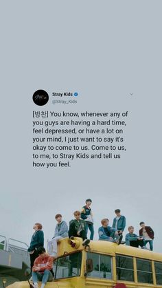 a group of people sitting on top of a school bus with the words stay kids