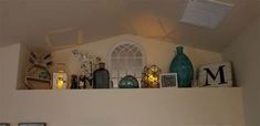 the shelves above the bed are filled with decorative items