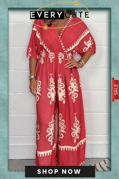 Printed Cross Front Jumpsuit Relaxed Fit V-neck Jumpsuits And Rompers For Vacation, Red Printed V-neck Jumpsuits And Rompers, Long Sleeve Printed Jumpsuits And Rompers For Beach, Long Sleeve Printed Jumpsuits For Beach, Long Sleeve Printed Jumpsuits For The Beach, Printed Jumpsuits And Rompers For Summer Loungewear, Casual Printed Jumpsuit For Vacation, Pink Printed V-neck Jumpsuits And Rompers, Printed Long Sleeve Jumpsuit And Romper For Vacation