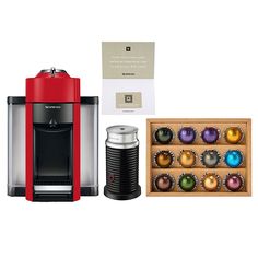 a red coffee maker next to an assortment of christmas ornaments and a box of chocolates