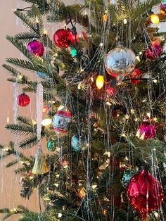 a christmas tree with ornaments hanging from it