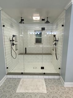 a walk in shower sitting inside of a bathroom