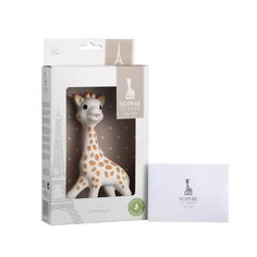 a toy giraffe is in the packaging