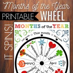 the months of the year wheel is shown on a wooden surface with text overlay