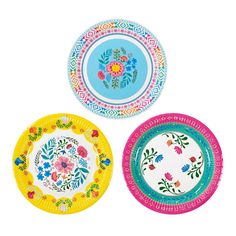 three paper plates with different designs on them