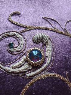 a close up of a piece of cloth with beads on it