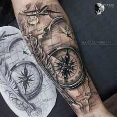 a man's arm with a map and compass tattoo on it