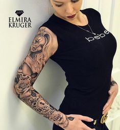 a woman with tattoos on her arm and shoulder