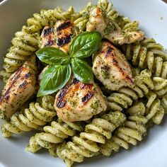 pasta with pesto and chicken on top