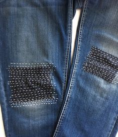 an old pair of jeans with holes in them