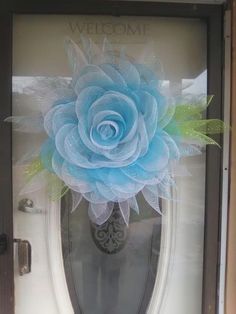 a blue flower is on the front door