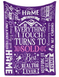 a purple and white wall hanging tapestry with words in different languages, including the word home