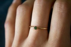 STUNNING 14k gold filled or Sterling Silver handmade Nephrite Jade ring ✨ * Listing covers the single Nephrite Jade ring. Beautiful 3mm olive green Jade gemstone✨⚒️ Jade is a special stone that is believed to promote wisdom, balance, and peace. Jade has a history that traces back to prehistoric times, to the ancient Chinese, the Maori, and to the Aztecs and Inca peoples of Central America. Reputed by folklore to attract love, this stone was also believed to deliver prosperity and power to those Minimalist Gold Emerald Stackable Ring, Dainty Gold Emerald Ring With Round Band, Gold Emerald Ring With Round Band For Everyday, Everyday Gold Emerald Ring With Round Band, Green Minimalist Stackable Rings As Gift, Green Minimalist Stackable Rings For Gift, Everyday Green 14k Gold Stackable Rings, Dainty Green Jewelry With Simple Design, Minimalist Gold Stackable Rings For May Birthstone