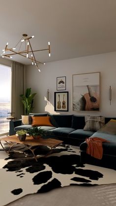 a living room filled with furniture and a large window overlooking the ocean in front of it