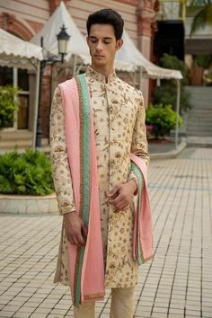 Custom Made Indian Pakistani Sherwani With Pants Outfit Kindly Get In Touch * Fabric - Raw Silk Groom's Sherwani * Work Type -Embroidery Work * Color - Light Beige * Bottom - Light Beige Chudidar Price Does Not Includes the Dupatta In Image Velvet Dupatta With * Golden Lace (may not be exact as picture) * Georgette Mint green embroidery Dupatta Price may range from 115 - 145 USD depending on customization Pls Not - This Listing Does not Includes Jewelry, Stole & Inner Kurta, of course we can pro Designer Long Sleeve Sets With Dupatta, Fitted White Outerwear With Zari Work, Designer Fitted Cream Sets, Designer Long Sleeve Sherwani With Dupatta, Beige Fitted Traditional Wear With Long Sleeves, Designer Long Sleeve Beige Sherwani, Cream Bandhgala With Dupatta, Cream Bandhgala With Long Sleeves And Dupatta, Cream Bandhgala With Dupatta And Long Sleeves