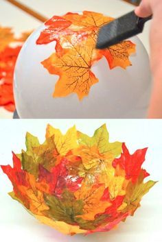 someone is painting leaves on a paper ball