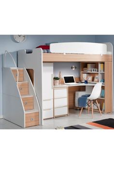 a loft bed with stairs and desk in the corner, next to a white chair