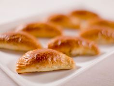 several pastries on a white square plate