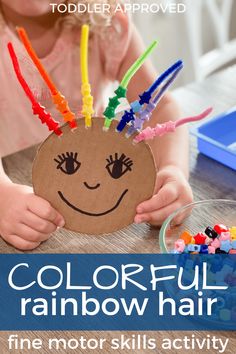 a child holding up a paper plate with colorful hair on it and the words crazy rainbow hair