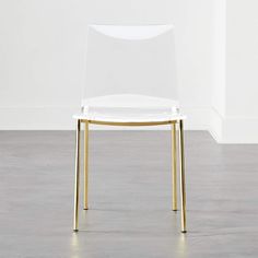 a white chair with gold legs and a clear seat cover on it's back