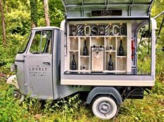 an old truck with wine bottles in the back