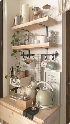 the shelves have pots, pans and other kitchen utensils on them as well