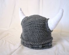 a crocheted viking hat with horns on it