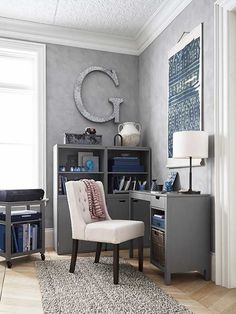 a white chair sitting in front of a gray desk