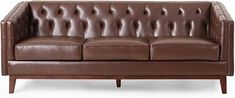 a brown leather couch sitting on top of a wooden frame