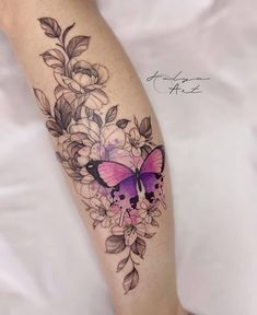 a woman's leg with flowers and a butterfly on it