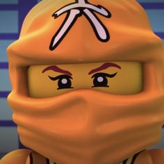 a close up of a lego figure wearing a face mask