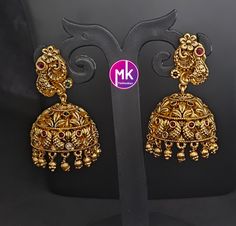 Peacock Premium Quality Gold finish AD stone Jhumka with Hanging gold balls - MK Fashionkart - Fashion Jewelry Material: Gold finish with AD stones MK Fashionkart Indian Fashion Jewelry Suitable for Saree/Salwar/party wear dresses   SHIPPING : Ready to ship in 1 business day. This item will be shipped from The United States. Jewelry care instructions : 1. Please wipe the jewelry with a piece of cotton cloth after usage.  2. Store the jewelry in a cool, dry and air tight box or pouch.  3. Make sure the jewelry is away from direct heat and water. 4. Please wipe of any moisture, sweat, soap water after usage. Indian Fashion Jewellery, Jewelry Care Instructions, Party Wear Dresses, Jewelry Care, Gold Finish, Indian Fashion, Party Wear, Favorite Jewelry, Jewelry Earrings Dangle