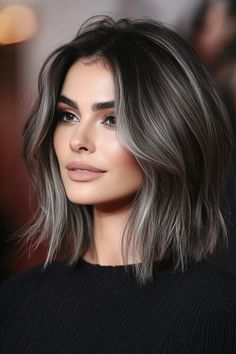 Click for More ➡️ | Save for Later ❤️  The stacked bob’s layers create volume at the crown, and ash grey highlights add a cool, contemporary edge to fine hair, making it look thick and sleek. (Stacked Bob with Ash Grey Highlights - Layered Hairstyles For Thin Hair) Gray Blending Hair Black, Thick Highlights On Black Hair, Gray Streaks In Dark Hair, Dark Brown Hair With Gray Highlights, Gray Highlights On Brown Hair, Dark Hair Grey Highlights, Highlights To Blend Gray Hair Dark Brown, Ideas For Grey Hair, Dark Brown Hair With Grey Highlights