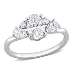 a three stone ring with pear shaped diamonds on the shoulders and sides, set in 18k white gold