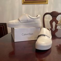 Calvin Klein Jaiden Cow Silk Platinum White Slip On Sneaker Trainers Walking. Never Worn. Chic Platform Slip-on Sneakers, Chic White Platform Sneakers, Calvin Klein Sneakers, White Slip On Sneakers, Black High Top Sneakers, Womens Tea, Beige Sneakers, Calvin Klein White, Calvin Klein Shoes