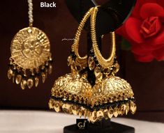 Gold plated high quality jhumka tikka pearl set. Light in weight. *Earrings length: 3.7 inches (with drops) *Circle inner diameter- 1.7 inches *Dome Size: 1.3 inches *Tikka Diameter: 1.4 inches Black Jewelry With Latkans For Navratri, Black Temple Jewelry Earrings For Festive Season, Festive Black Temple Jewelry Earrings, Elegant Black Jhumkas For Festive Occasions, Black Temple Jewelry Earrings For Wedding, Black Earrings For Wedding And Diwali, Black Round Jhumkas As Gift, Black Chandbali Danglers For Party, Traditional Black Earrings For Festive Occasions