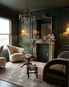 a living room filled with furniture and a chandelier