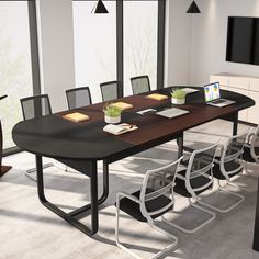 a large conference table with chairs around it in an office setting that looks very modern