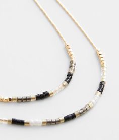 "Boutique By BKE Layered Necklace - Gold 14-19, Women's Gold Beaded metal necklace Shortest tier length measures 18". Apparel & Accessories" Black Beaded Metal Dangle Necklaces, Black Long Metal Beaded Necklace, Adjustable 14k Gold-filled Beaded Necklaces, Cheap Hand-strung Black Beaded Necklaces, Elegant 14k Gold-filled Bar Necklace, Gold Necklace Layered, Metal Necklaces, Gold Beads, Layered Necklaces