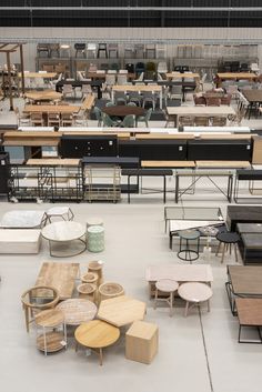 tables and stools are arranged on the floor