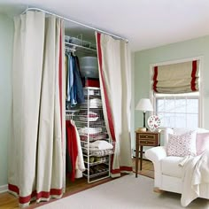 a living room filled with furniture and lots of closet space in front of a window