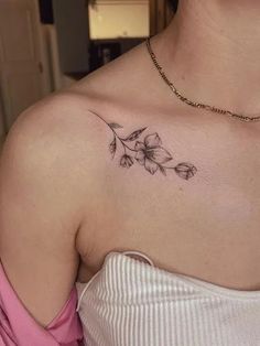 a woman with a tattoo on her shoulder