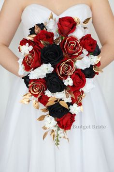 a bridal holding a bouquet of red and white flowers