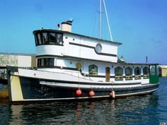 a large white boat floating on top of a body of water