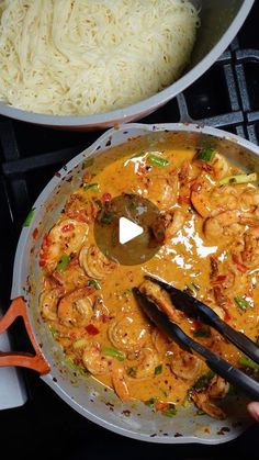 two pans filled with food sitting on top of a stove next to each other