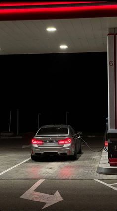 a car is parked at a gas station