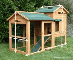 a large wooden chicken coop with measurements for the roof and side walls, shown in front of some bushes