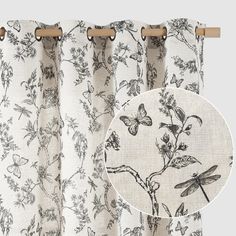 the curtains are hanging up with dragonflies and flowers on them, along with a white background