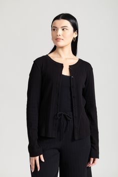 A must-have classic cardigan in a timeless black soft cotton pointelle that’s a lightweight, warm-weather ready layer. Model 5’10” – Wearing Size S Made in LA, Fabric made in USA 100% COTTON Cotton Button-up Cardigan For Daywear, Relaxed Fit Cotton Cardigan For Daywear, Cotton Cardigan With Buttons For Daywear, Black Cotton Relaxed Fit Cardigan, Black Cotton Button-up Cardigan, Classic Cardigan, Black Cardigan, Warm Weather, Lay Flat